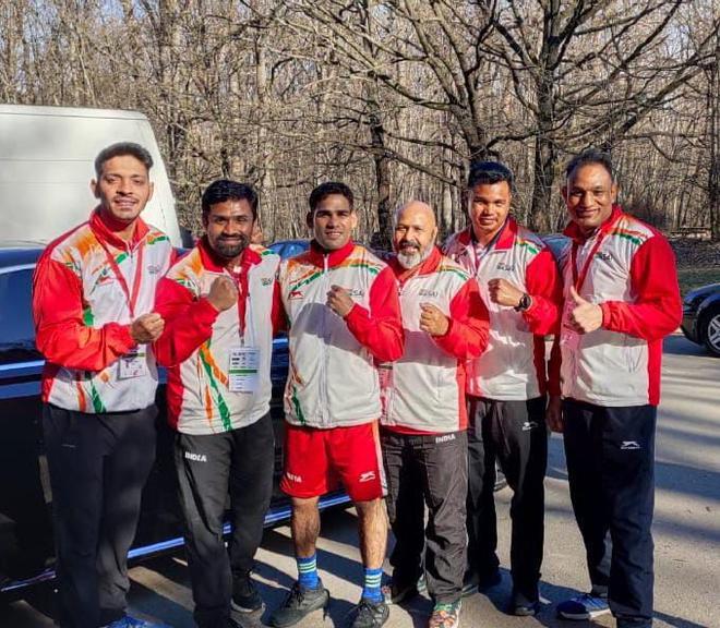 Hussamuddin with coaches after the win today.