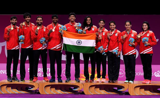 The Indian badminton mixed team pose after winning gold in the mixed team event against Malaysia at the 2018 Commonwealth Games.