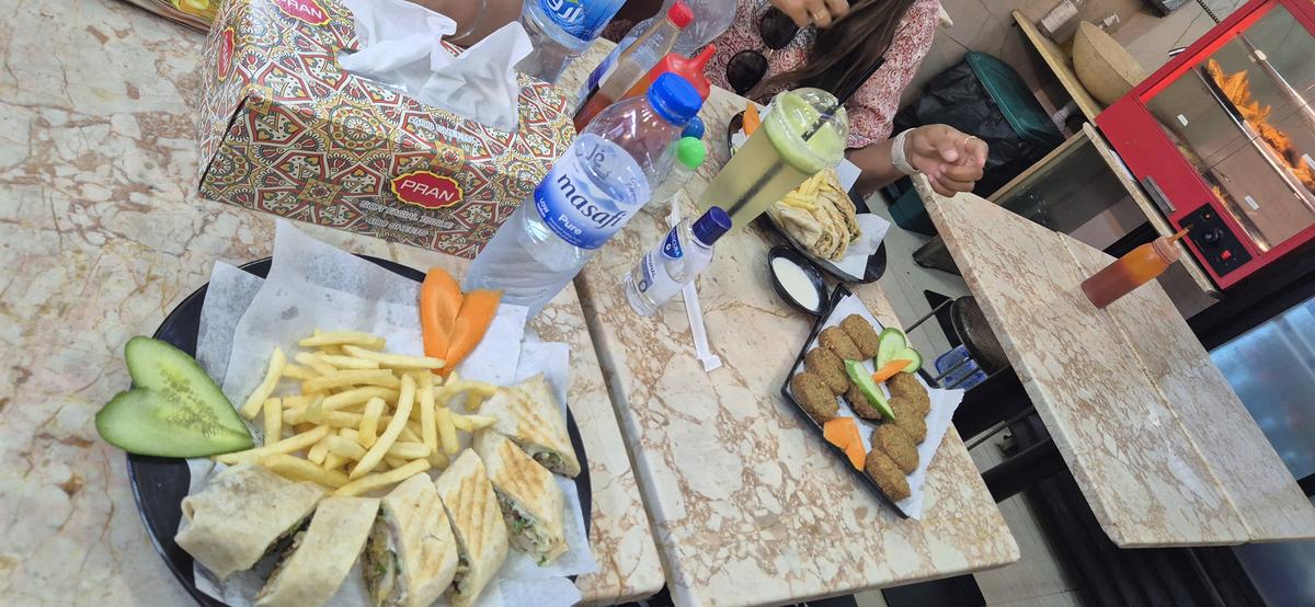 A sumptuous meal: The shawarma was our first outdoor meal after days of media room food and home-cooked meals, and it was prepared modestly to save money.