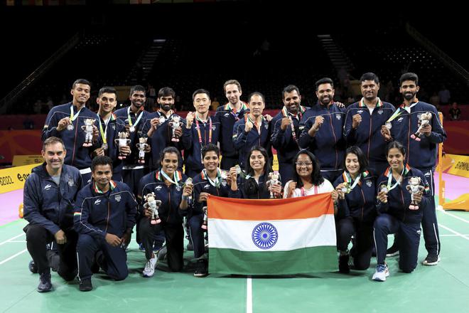 India shuttlers celebrate winning the silver medal in the Badminton Mixed Team event on Tuesday. 