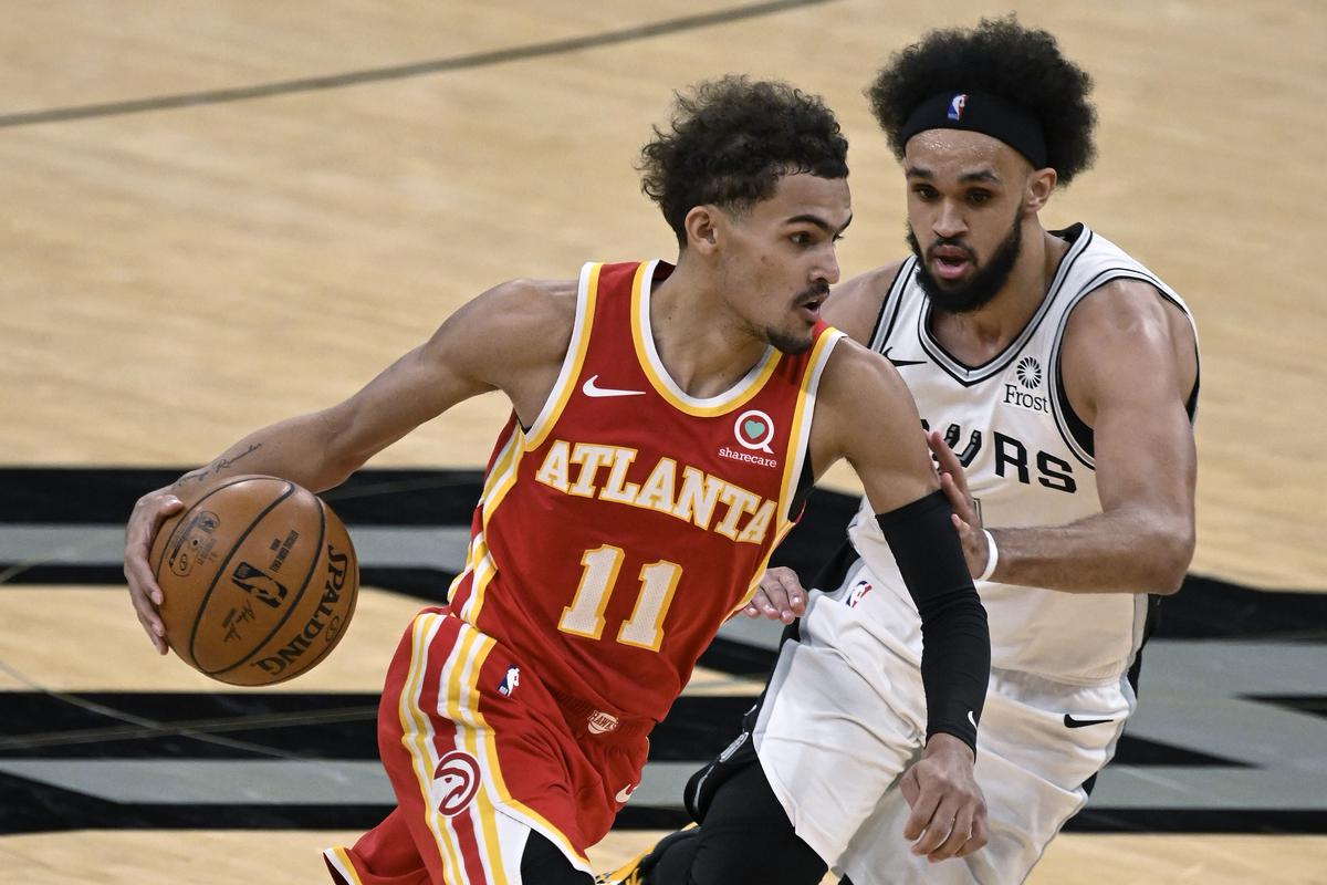 NBA star Trae Young shows up to a game with Lionel Messi's