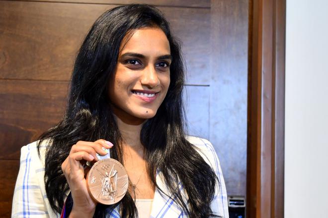 P.V. Sindhu showing her Tokyo Olympics bronze medal. (File Photo)