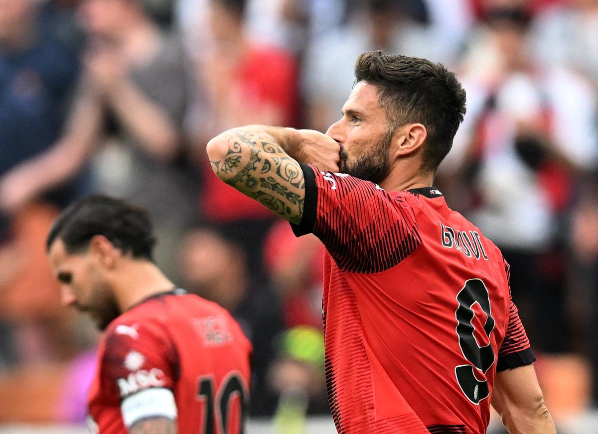 Giroud celebrates scoring a goal for AC Milan in the Serie A.