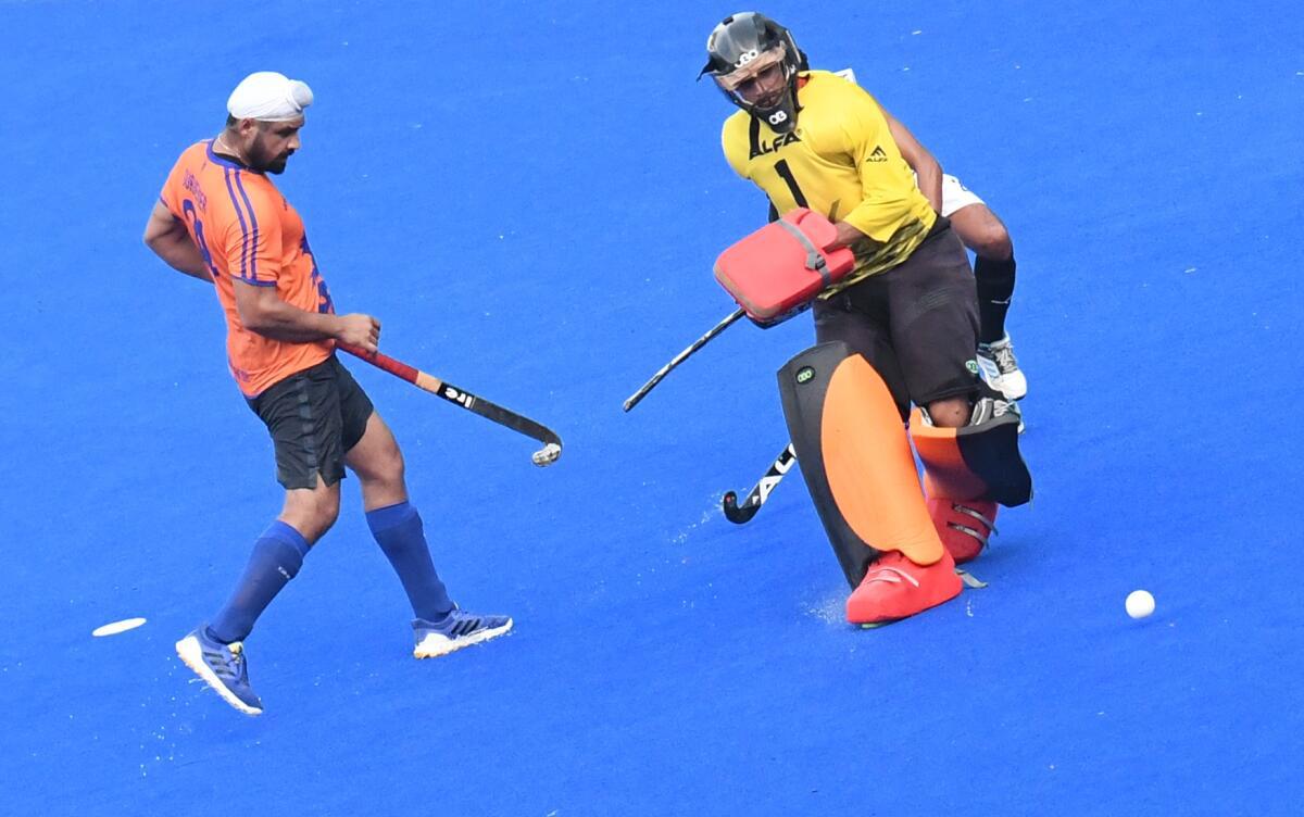 Gurjinder Singh of Indian Oil Corporation Ltd scored a goal against Karnataka during the All India MCC Murugappa Gold Cup Hockey Tournament at Mayor Radhakrishnan Stadium in Chennai on Monday. 