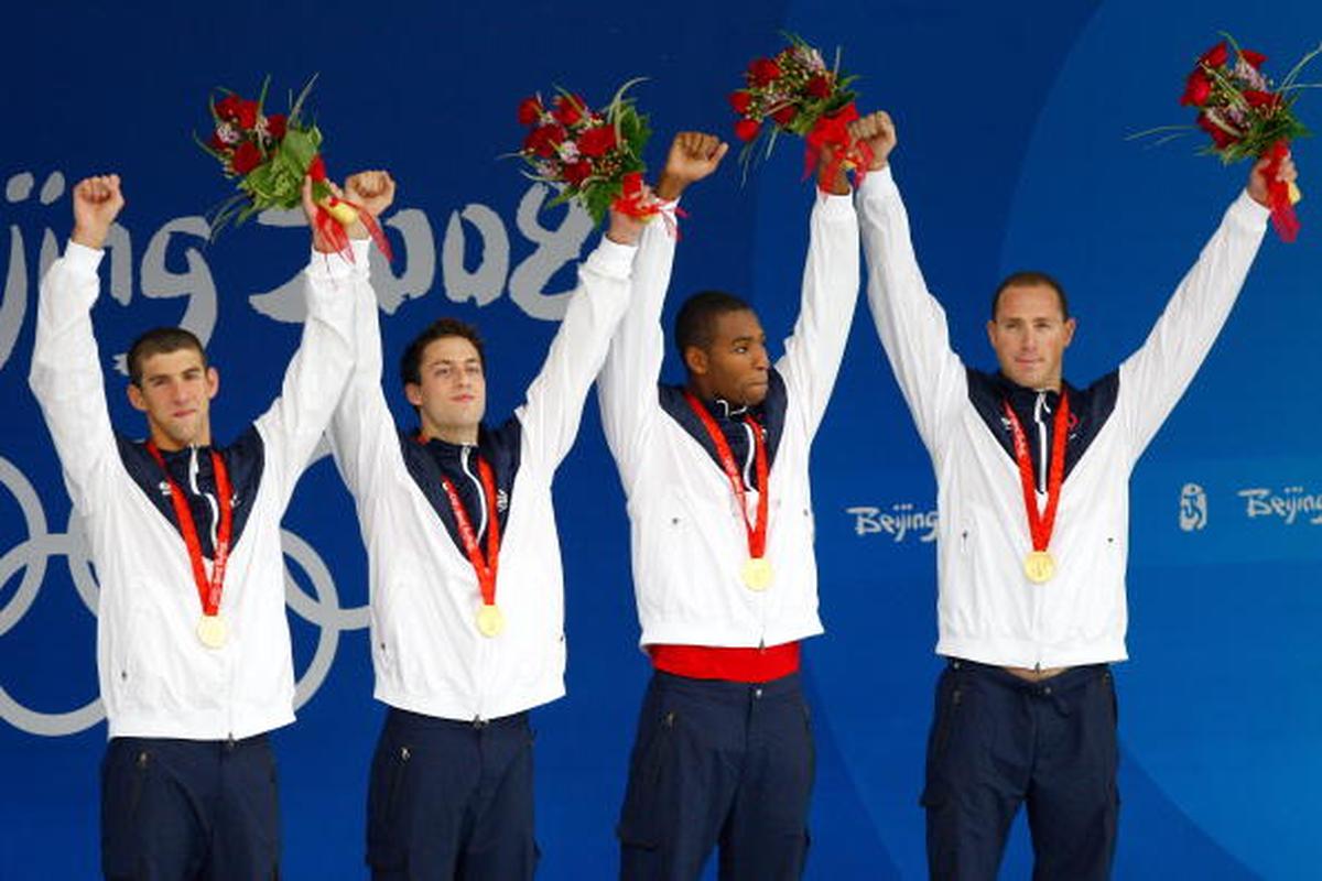 From left to right: USA’s Michael Phelps, Garrett Weber-Gale, Cullen Jones and Jason Lezak pose with the gold medal after winning the Men’s 4 x 100m Freestyle Relay at the National Aquatics Center on Day 3 of the Beijing Olympic Games on August 11, 2008.