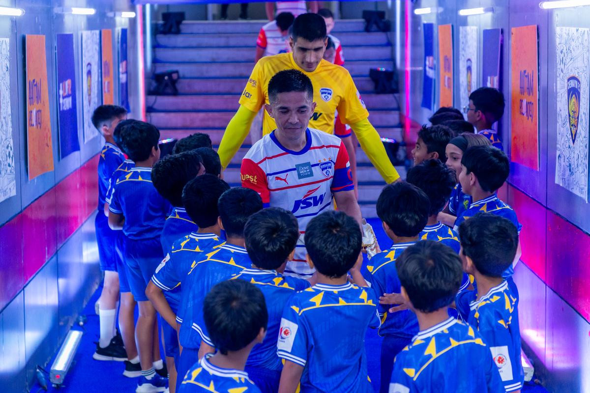 Young fans interact with BFC captain Sunil Chhetri at the Jawaharlal Nehru Stadium, Chennai, on December 13, 2023.