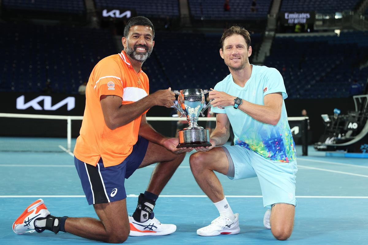 India’s Rohan Bopanna (left) and Australia’s Matthew Ebden (right) pose with the championship trophy after beating Simone Bolelli and Andrea Vavassori of Italy in the men’s doubles final at the Australian Open in Melbourne.