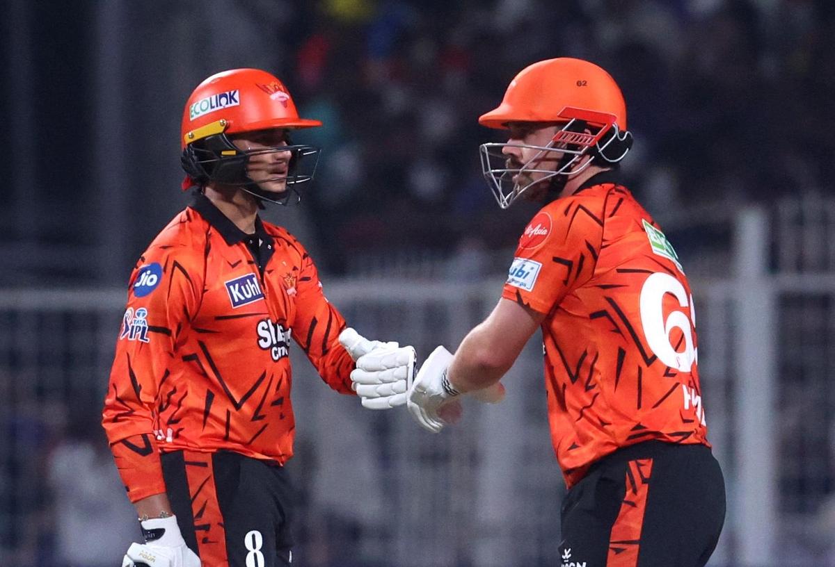 Sunrisers Hyderabad's Travis Head bumps fists with Abhishek Sharma.
