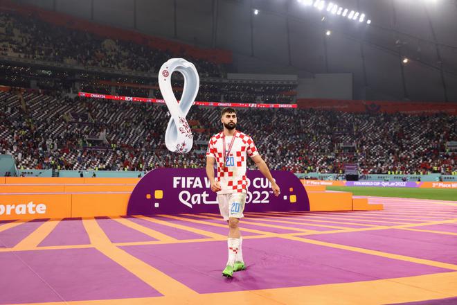 Josko Gvardiol of Croatia celebrates with the FIFA World Cup Qatar 2022 third placed medal after the team’s victory during the FIFA World Cup Qatar 2022 3rd Place match between Croatia and Morocco at Khalifa International Stadium.