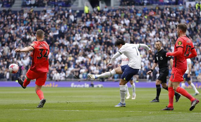 Special strike: Tottenham Hotspur’s Son Heung-min scores his side’s first goal against Brighton and Hove Albion. The South Korean became the first Asian to score 100 goals in the Premier League.