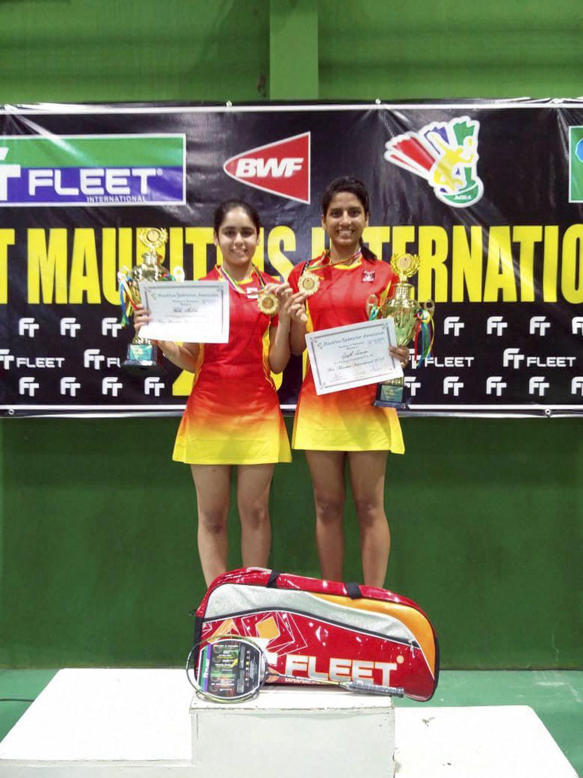 FILE PHOTO: Indian shuttlers Simran Singhi (R) and Ritika Thaker at an international tournament in 2018.