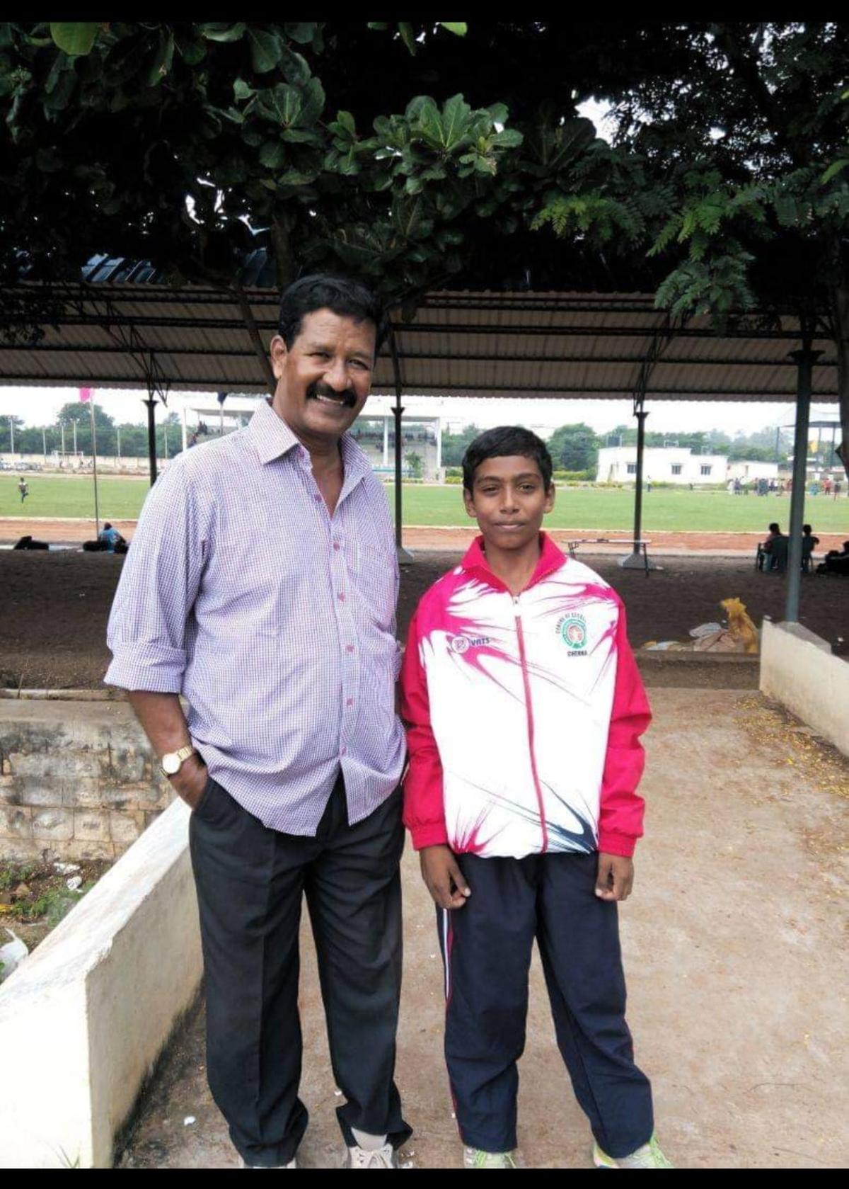 Vishal with coach John who buried him in the sand to try and address his ‘knock knees’