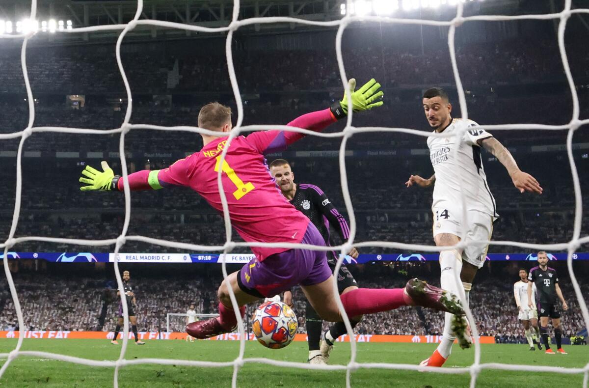 Joselu scores past Manuel Neuer after an error from the Bayern goalkeeper for Madrid’s first goal.