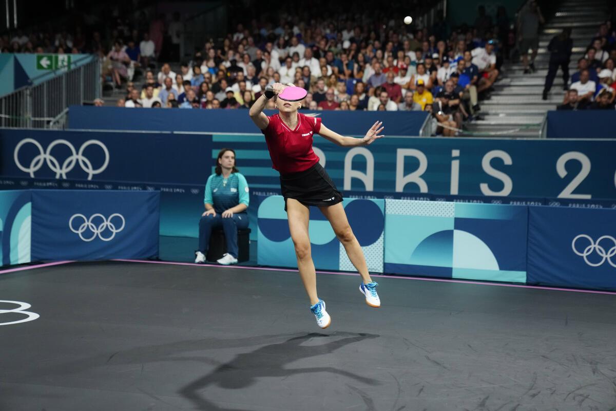 Romania’s Bernadette Szocs plays against India’s Archana Girish Kamath during a women’s teams round of 16 table tennis match at the 2024 Summer Olympics. 