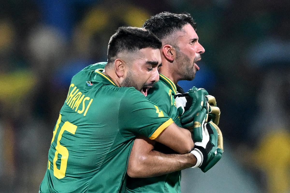 South Africa’s Tabraiz Shamsi (L) and Keshav Maharaj celebrate after their win at the end of the 2023 ICC Men’s Cricket World Cup one-day international (ODI) match against Pakistan at the MA Chidambaram Stadium in Chennai on October 27, 2023.