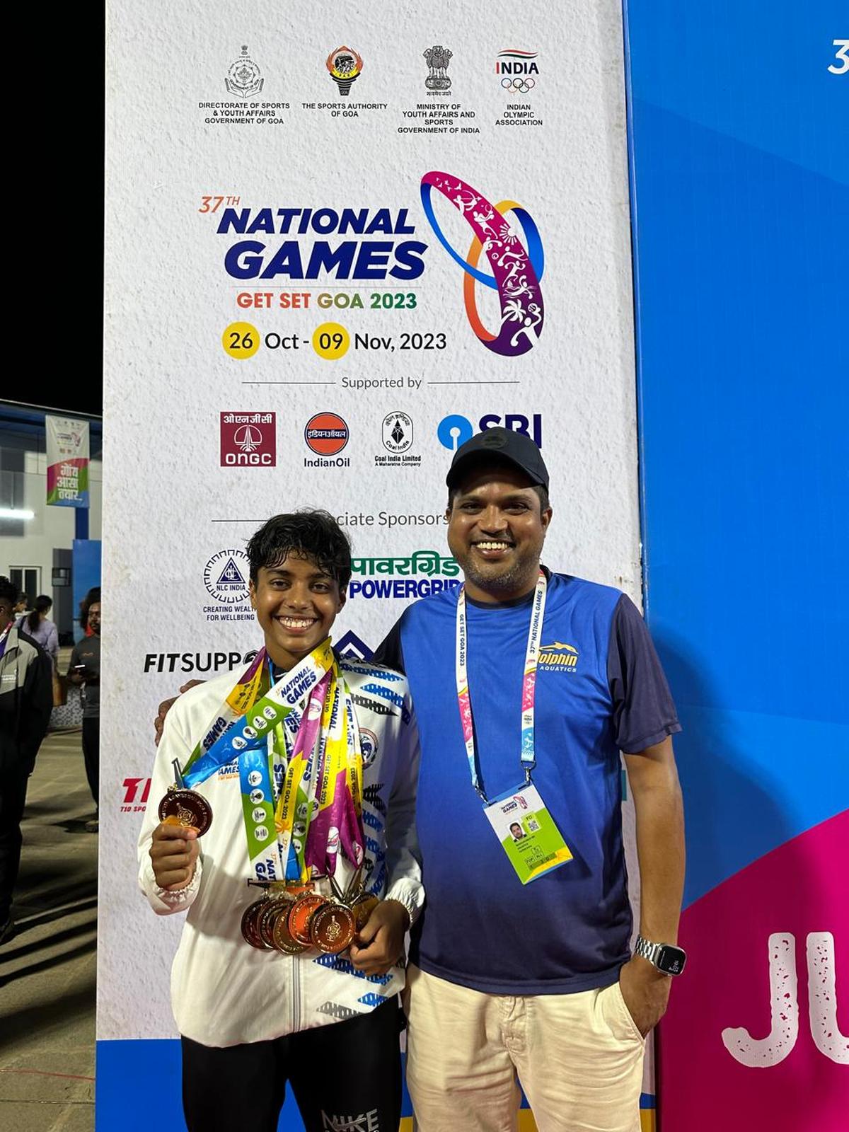 Dhinidhi with coach Madhu Kumar BM.