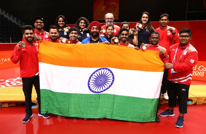 The gold medal-winning table tennis teams of India pose together at the 2018 Commonwealth Games.