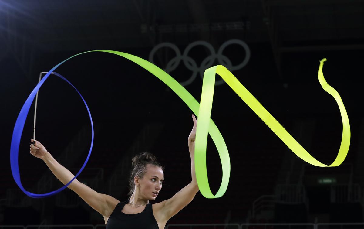 FILE - Ukraine’s Ganna Rizatdinova practices her routine a day ahead of the rhythmic gymnastics individual all-around qualifications at the 2016 Summer Olympics.