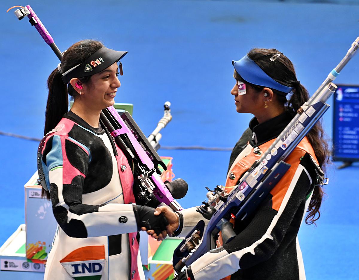 Ramita Jindal (left) congratulated by Elavenil Valarivan for topping women’s air rifle at the National shooting selection trials in Delhi on Tuesday.