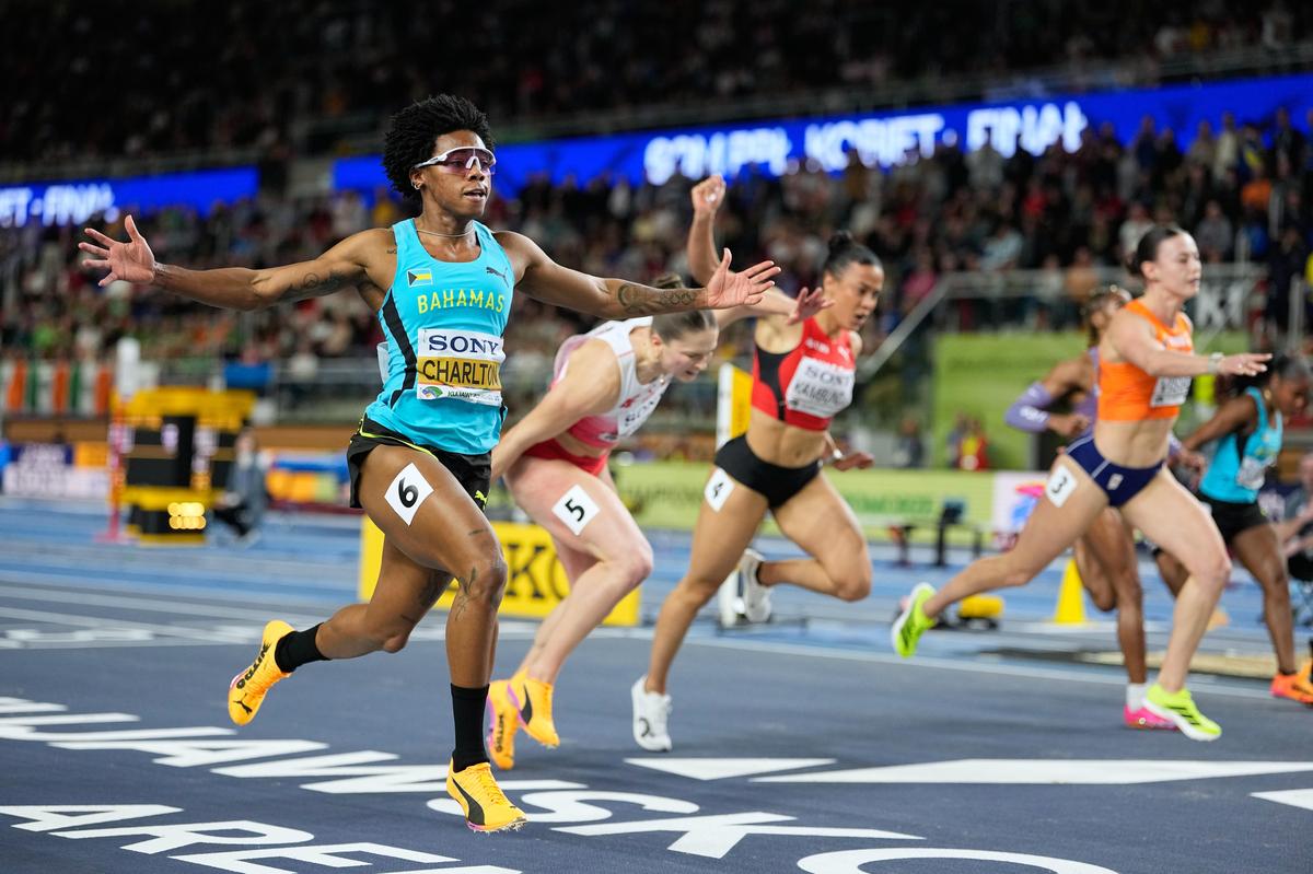 Devynne Charlton of the Bahamas crosses the finish line to match her own world record and win the gold medal in the women's 60 meters hurdles final at the World Athletics Indoor Championships in Torun, Poland, on Sunday.