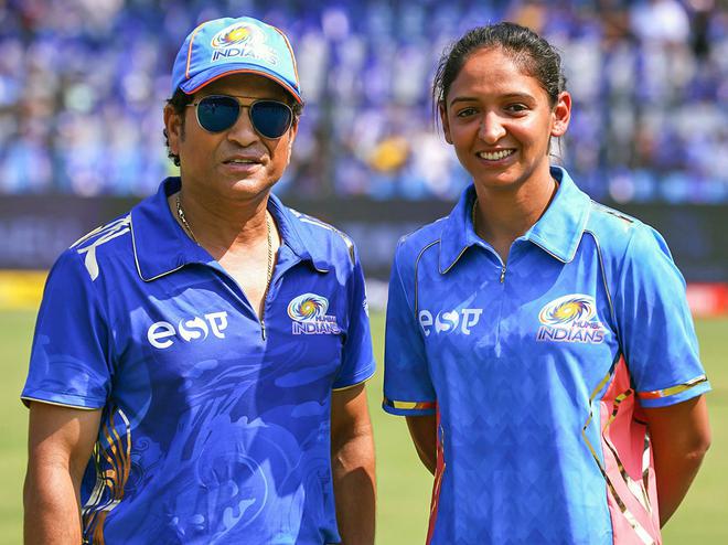 Sachin Tendulkar and Harmanpreet Kaur pose for a photo ahead of a match between Mumbai Indians and Kolkata Knight Riders at the Wankhede Stadium, in Mumbai.