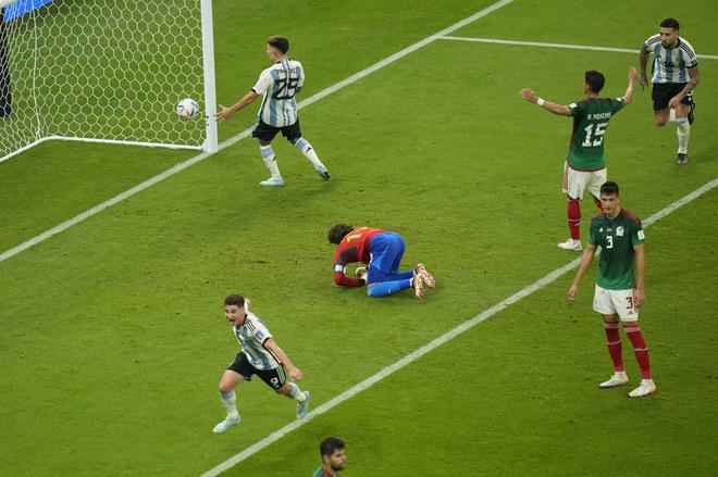 Mexico’s goalkeeper Guillermo Ochoa gives up a goal to Argentina’s Enzo Fernandez.