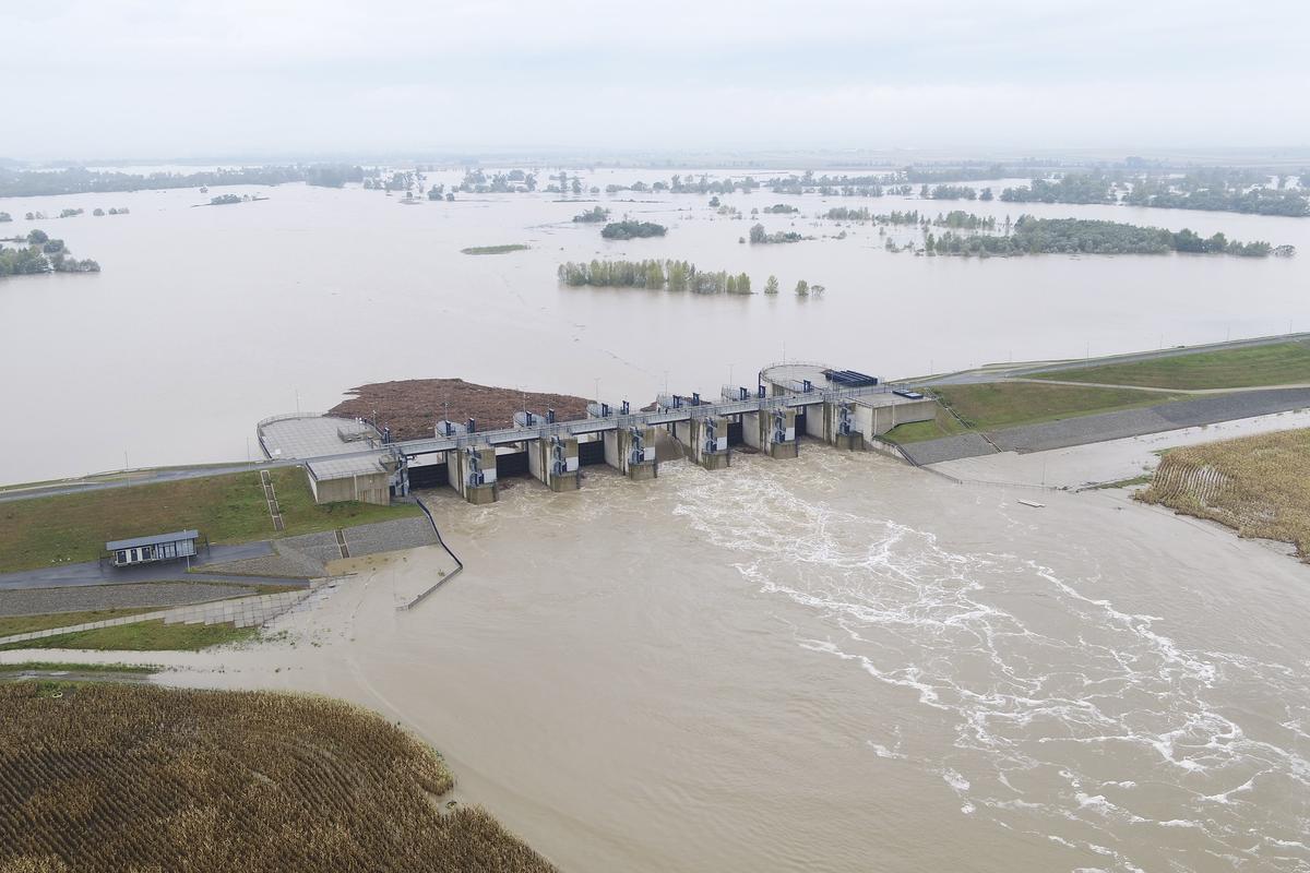 This photo provided by the state company Polish Waters shows the Oder River flood waters channelled into and contained by the newly-built Lower Raciborz Reservoir that has spared the cities of Opole and Wroclaw from flooding, in Raciborz, southwestern Poland. 