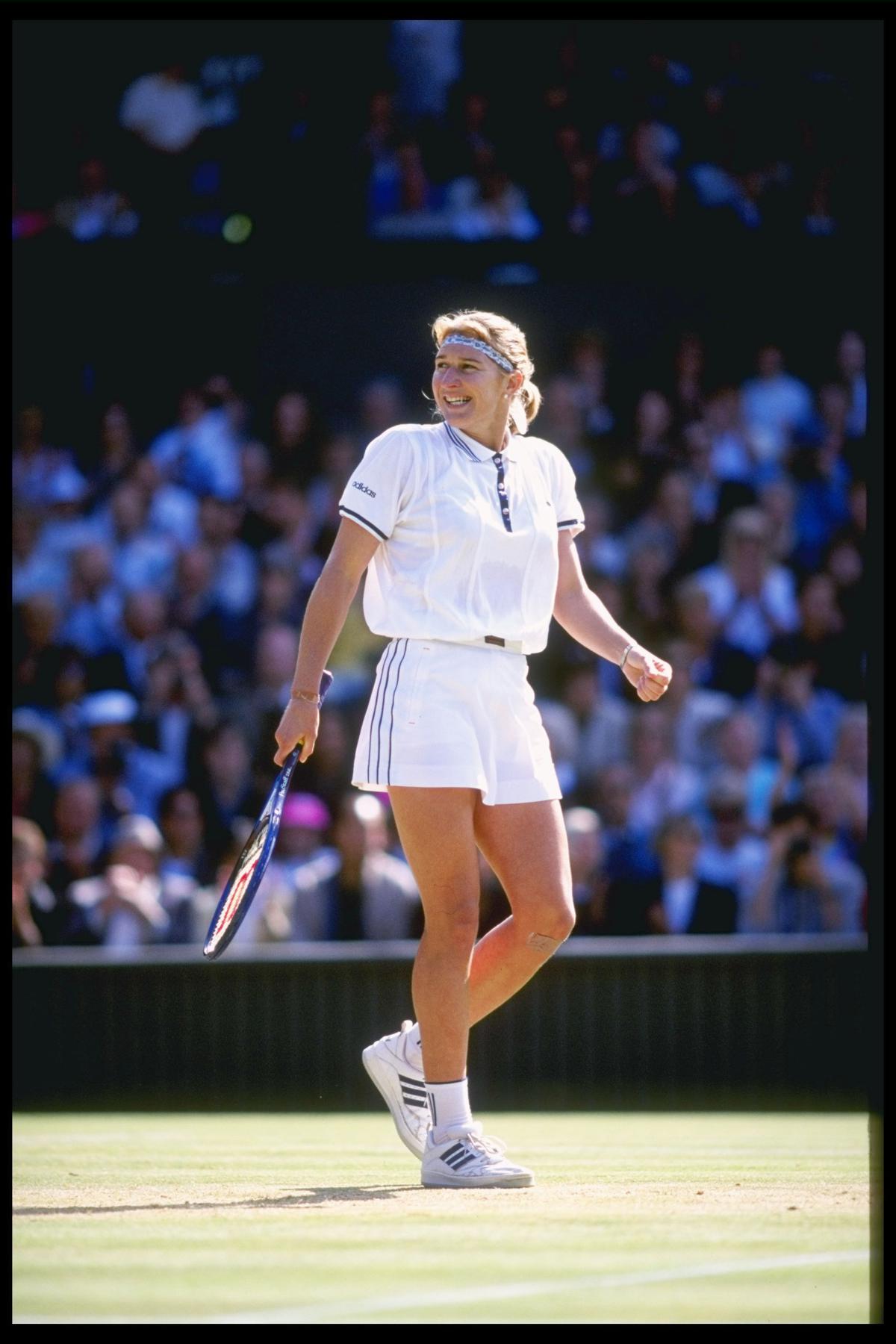6 Jul 1996:  A smile from Steffi Graf of Germany after she defeats Arantxa Sanchez Vicario of Spain in straight sets to yet again become ladies singles champion, during the Wimbledon tennis championships at the all England Club in London, England.Mandatory Credit: Clive Brunskill/Allsport UK