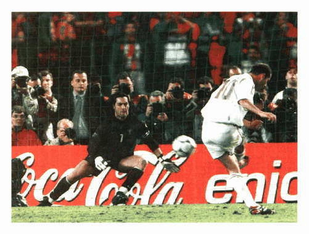 FILE PHOTO: France’s Zinedine Zidane fires in the ‘golden’ penalty past Portuguese
goalkeeper Vitor Baia to reward the World champion with a place in the final of the Euro 2000 football tournament at Brussels on Wednesday. 