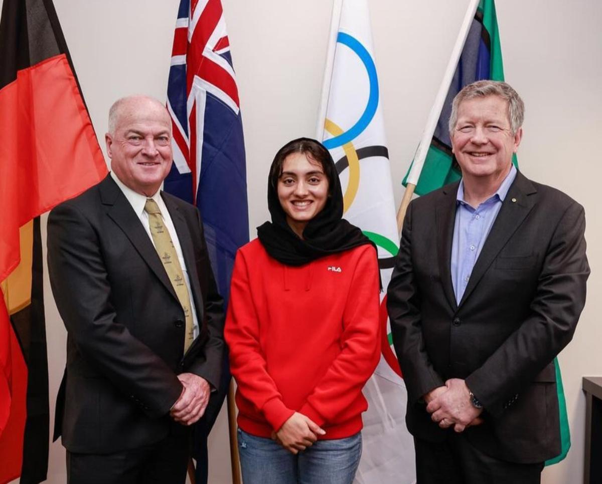 Kimia with her coach John Quinn (L).