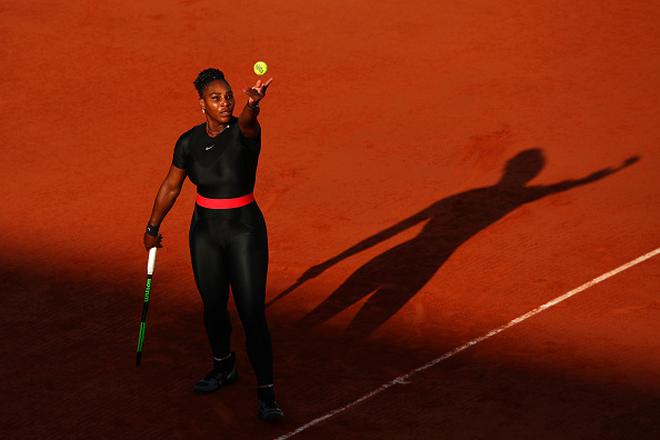 FILE PHOTO: Serena Williams serves during her third round match against Julia Georges of Germany during the 2018 French Open at Roland Garros on June 2, 2018 in Paris, France. Serena courted controversy, unintentionally, when she wore a full-length catsuit