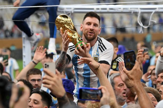 Lionel Messi of Argentina celebrates with the FIFA World Cup Qatar 2022 Winner’s Trophy after the team’s victory during the FIFA World Cup Qatar 2022 Final match between Argentina and France at Lusail Stadium.