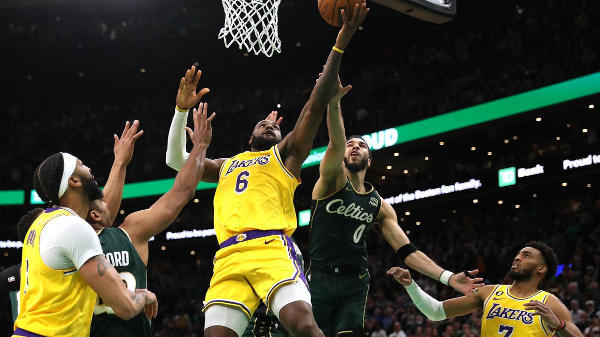 In this Feb. 7, 2019, photo, Boston Celtics forward Jayson Tatum adjusts  his knee sleeve during an NBA basketball game against the Los Angeles  Lakers in Boston. He is wearing Nike's latest