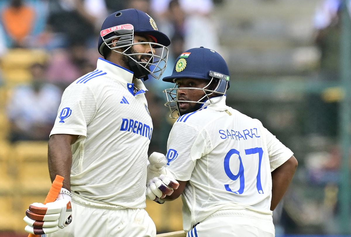 Sarfaraz and Pant take a run on Day 4 of the first Test between India and New Zealand at the M. Chinnaswamy Stadium(KSCA), in Bengaluru.