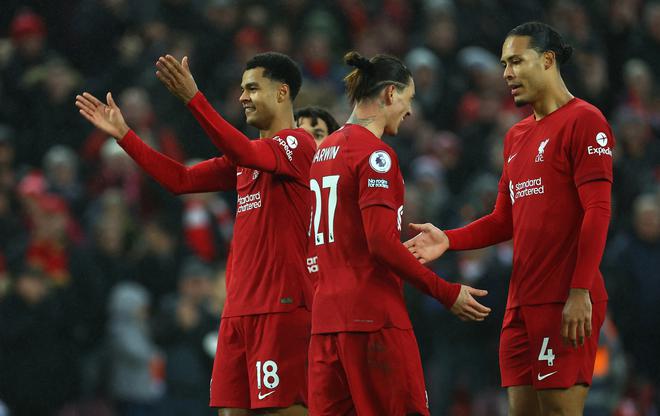 Liverpool’s Cody Gakpo celebrates scoring their third goal with Virgil van Dijk and Darwin Nunez.