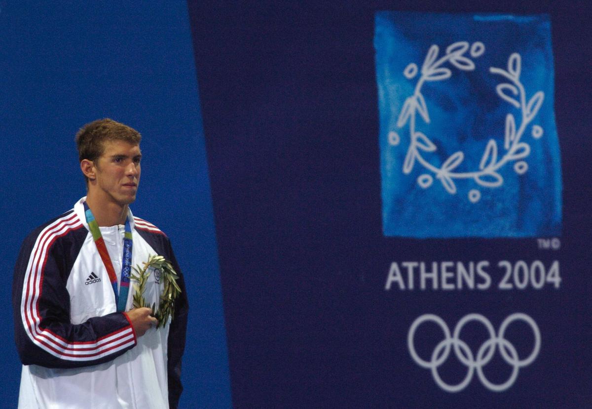 Michael Phelps of America, who created a new Olympic record with the timing of 51.35sec in the men’s 100m butterfly event of the Olympic Games 2004 in Athens. 