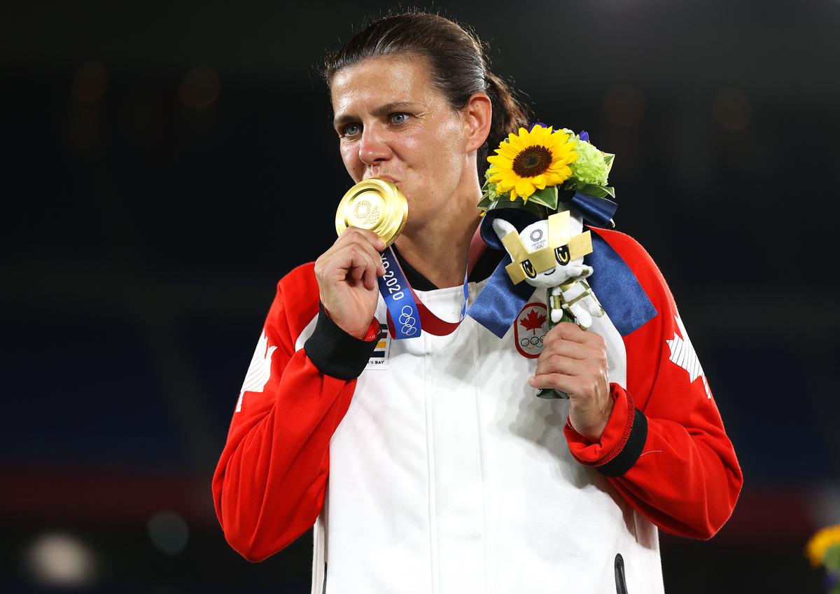 Gold medallist Christine Sinclair poses with her gold medal after the women’s football final at the Tokyo 2020 Olympic Games.