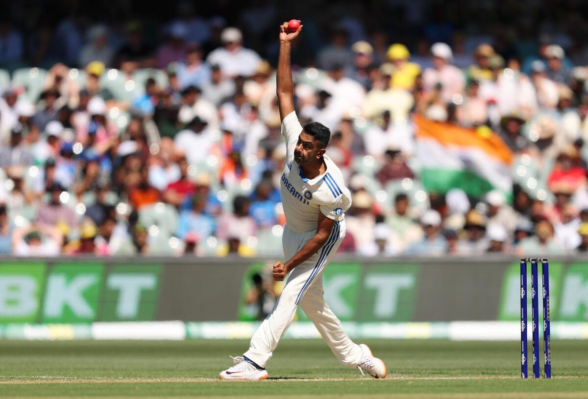 Ravichandran Ashwin of India bowls.