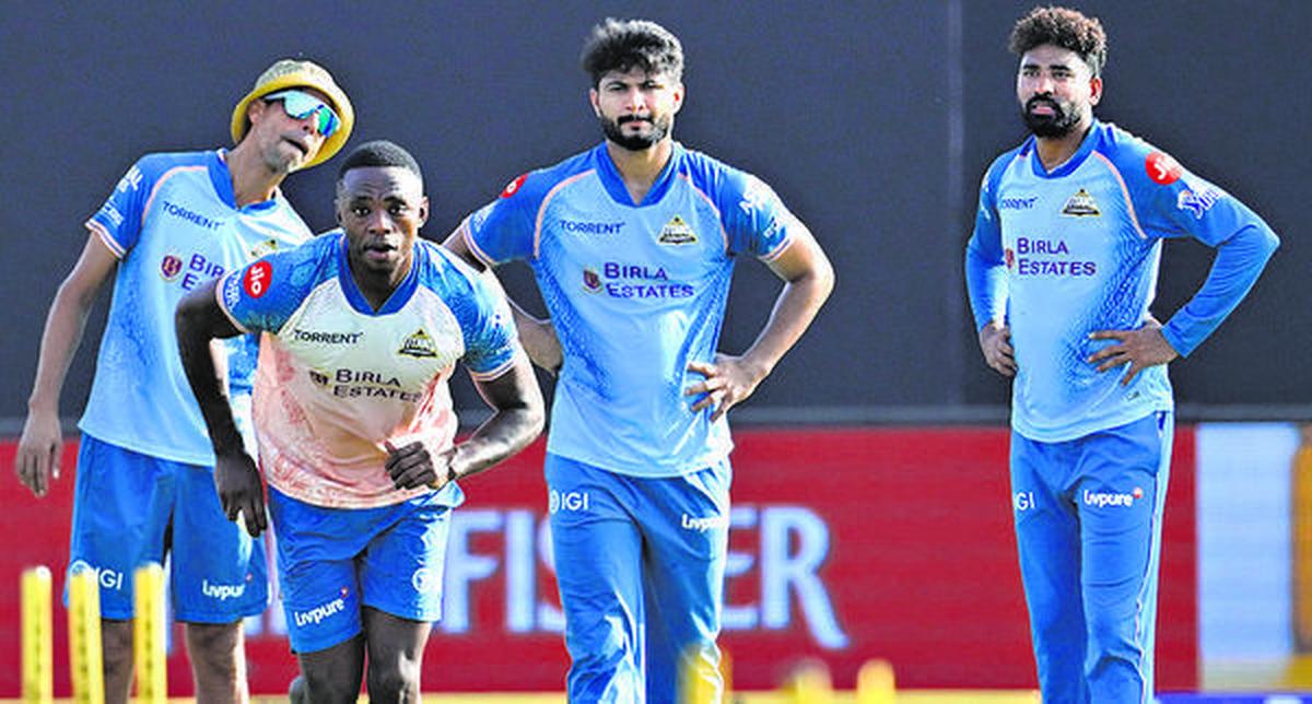 Gujarat Titans' Kagiso Rabada, coach Ashish Nehra, Mohammed Siraj and Arshad Khan during a practice session in IPL 2026.