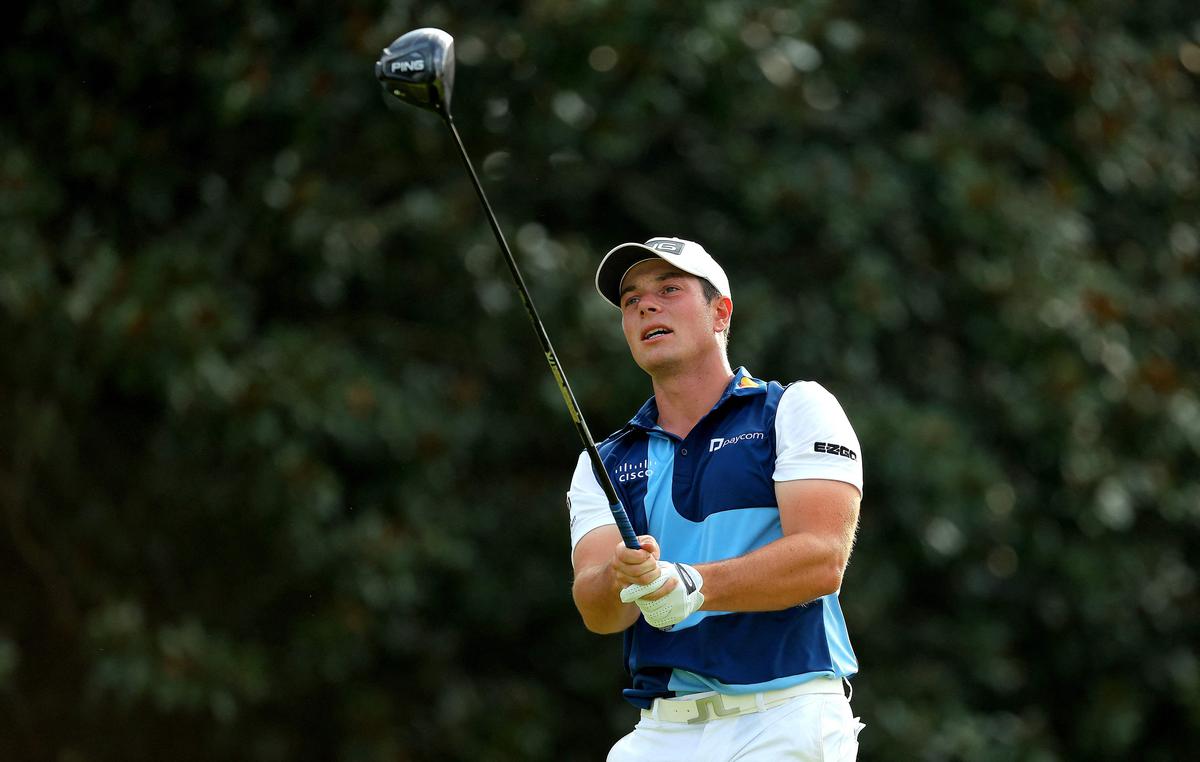 Viktor Hovland of Norway plays his shot from the 14th tee during the final round of the TOUR Championship at East Lake Golf Club. 