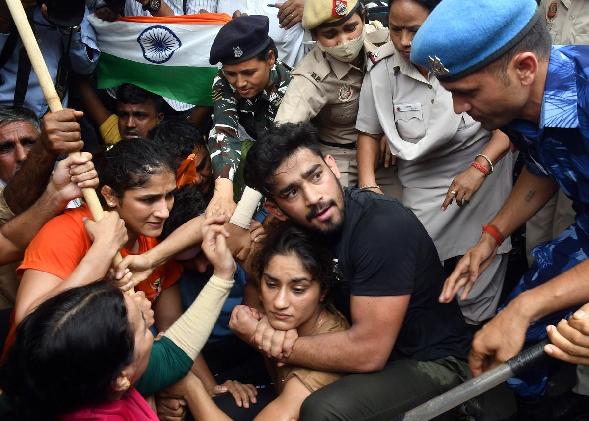 Wrestler Vinesh Phogat and Sangeeta Phogat during their protest march near WFI Chief’s residence, in New Delhi.