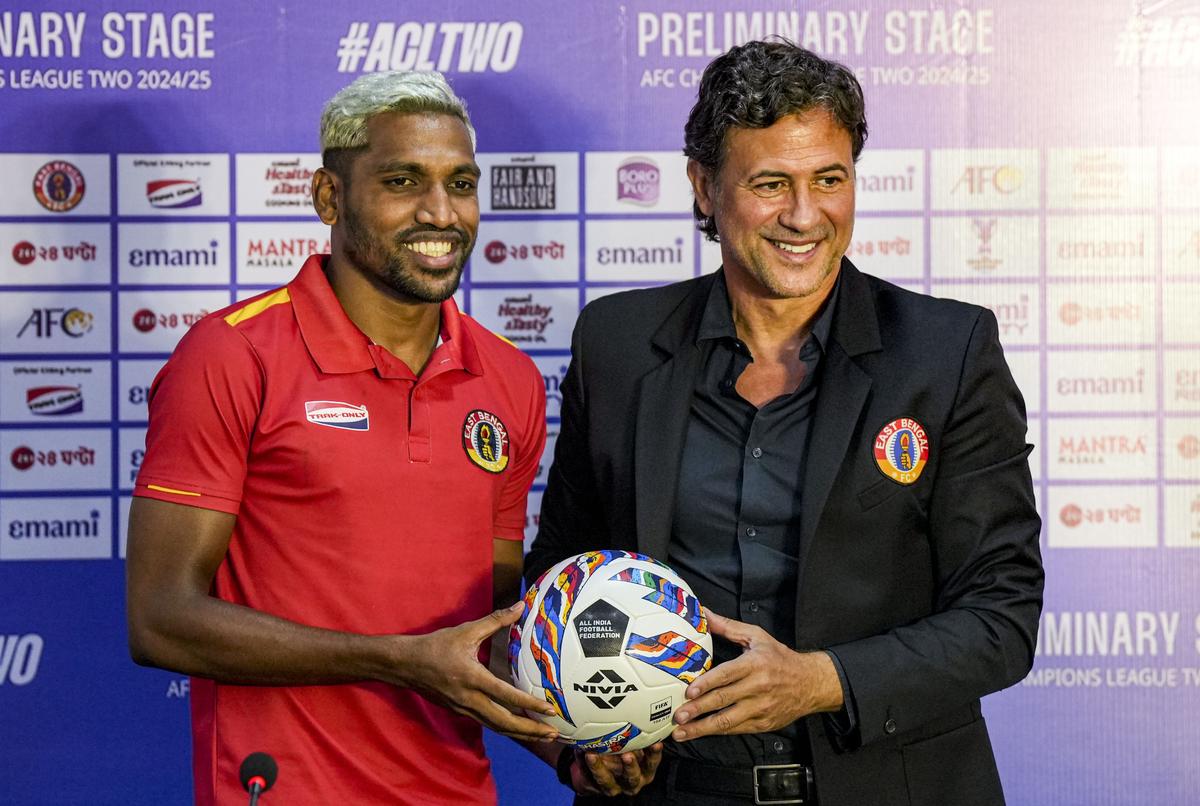 East Bengal FC head coach Carles Cuadrat and player Nandhakumar Sekar during a press conference on the eve of their AFC Champions League 2 preliminary stage playoff match.