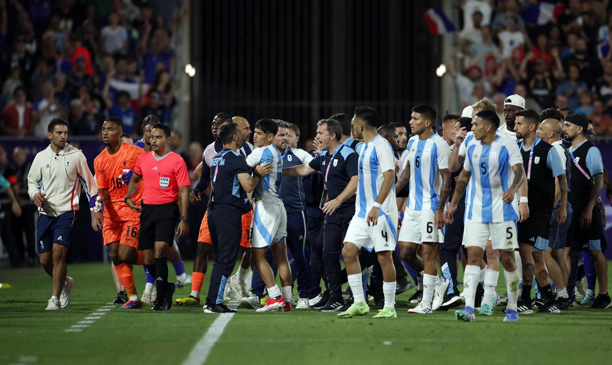 France and Argentina players clash.