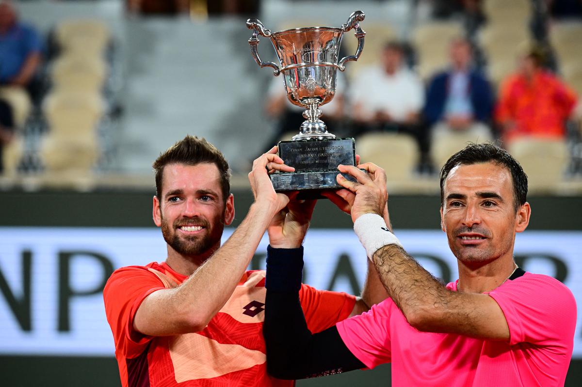 Croatia’s Ivan Dodig (right) and USA’s Austin Krajicek (left) celebrate with the Jacques-Brugnon Cup after winning men’s doubles title at French Open in 2023.