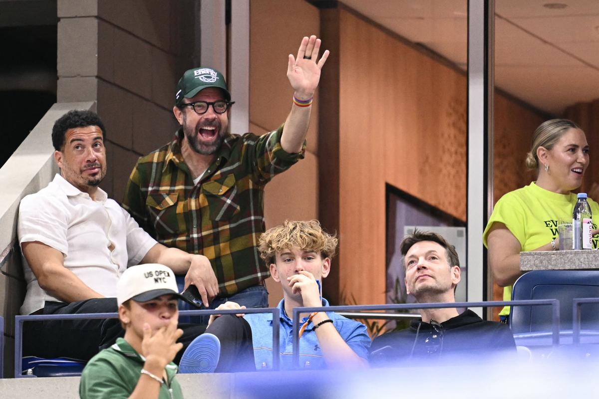 US actor and writer Jason Sudeikis (2nd L) waves as he attends the US Open 2024 women’s singles round of 16 match between Poland’s Iga Swiatek and Russia’s Liudmila Samsonova.