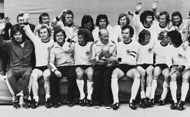 The West German team poses with the World Cup trophy after beating the Netherlands in the final at Olympic Stadium in Munich on July 07, 1974. 