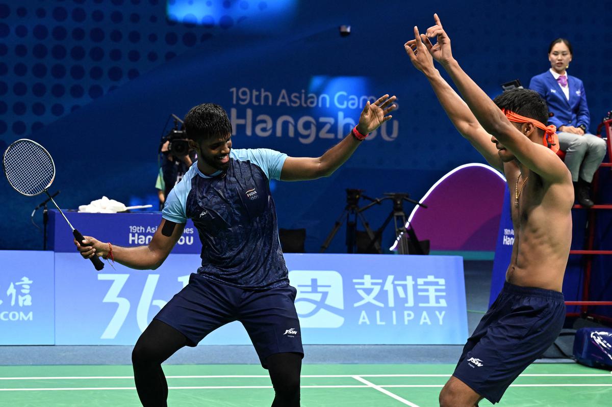 Putting on their dancing shoes: Satwiksairaj Rankireddy (L) and Chirag Shetty (R) break into a celebratory dance after bagging the Asian Games gold.