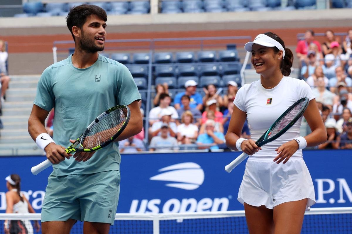Britain’s Emma Raducanu and Spain’s Carlos Alcaraz react during their round of 16 mixed doubles match against Britain’s Jack Draper and Jessica Pegula of the U.S. 