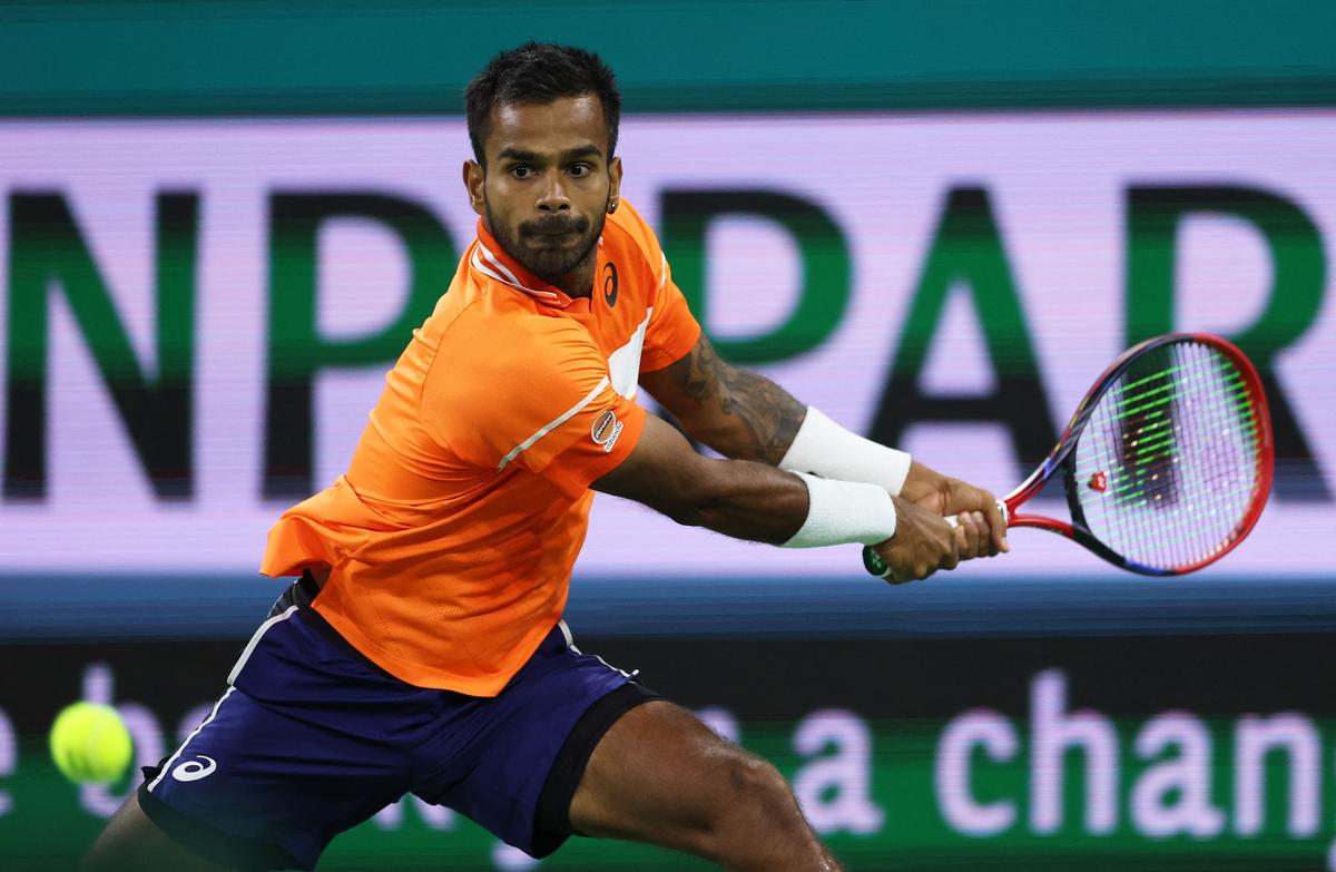 India’s Sumit Nagal plays a backhand against Canada’s Milos Raonic during their first round match at Indian Wells Tennis Garden on March 07, 2024.