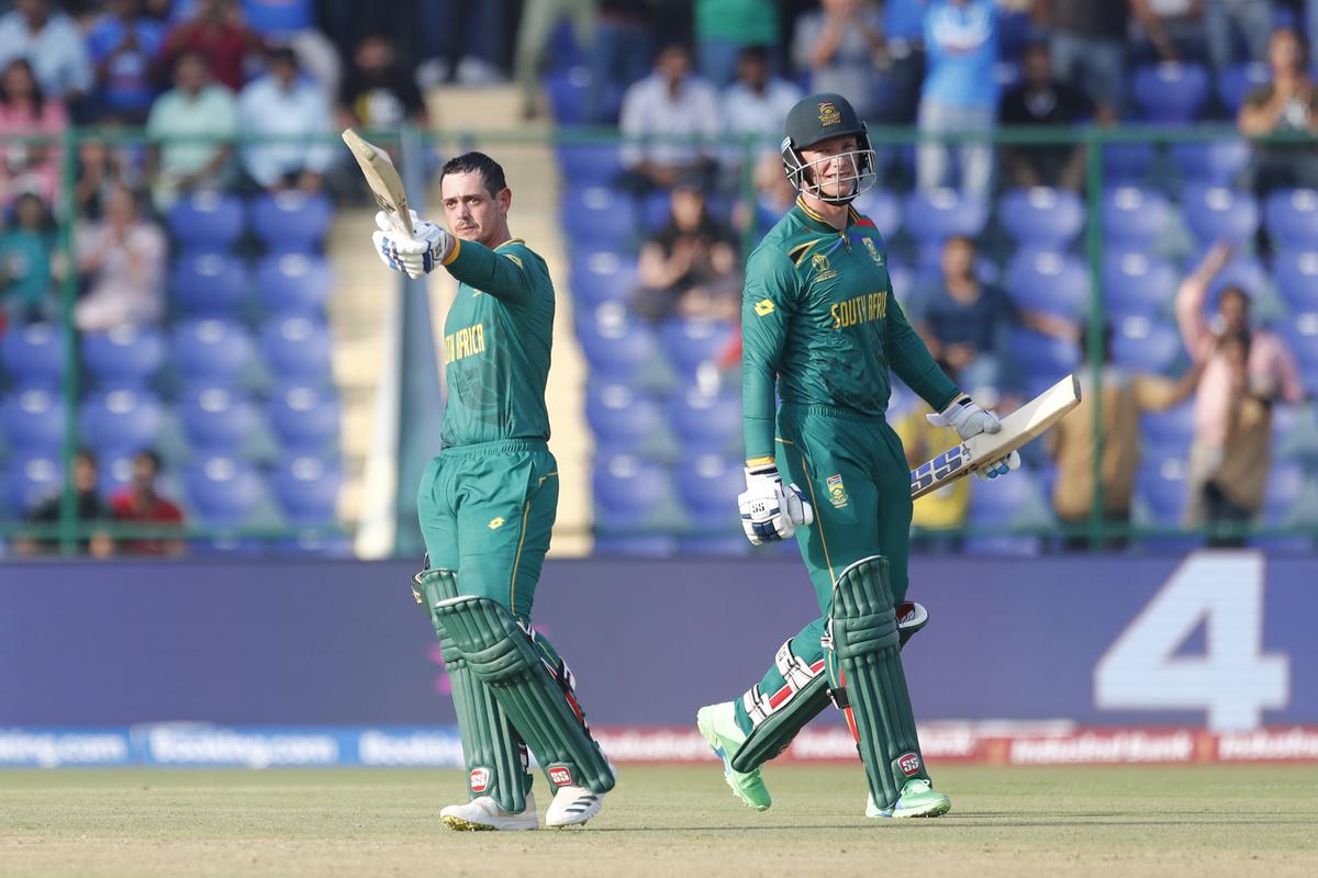 South Africa’s Quinton De Kock celebrates after scoring a hundred during the ICC Men’s Cricket World Cup 2023 match between South Africa and Sri Lanka at Arun Jaitley Stadium.